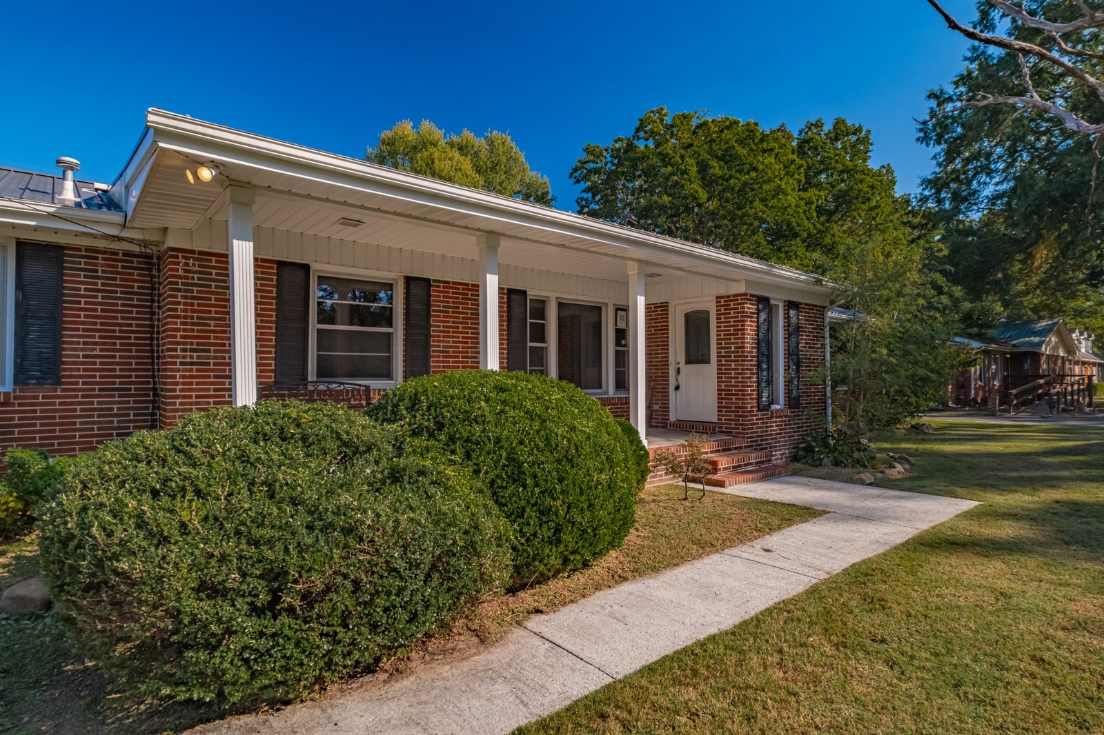 Brick exterior with shrubs at 1201 Woodcrest Drive