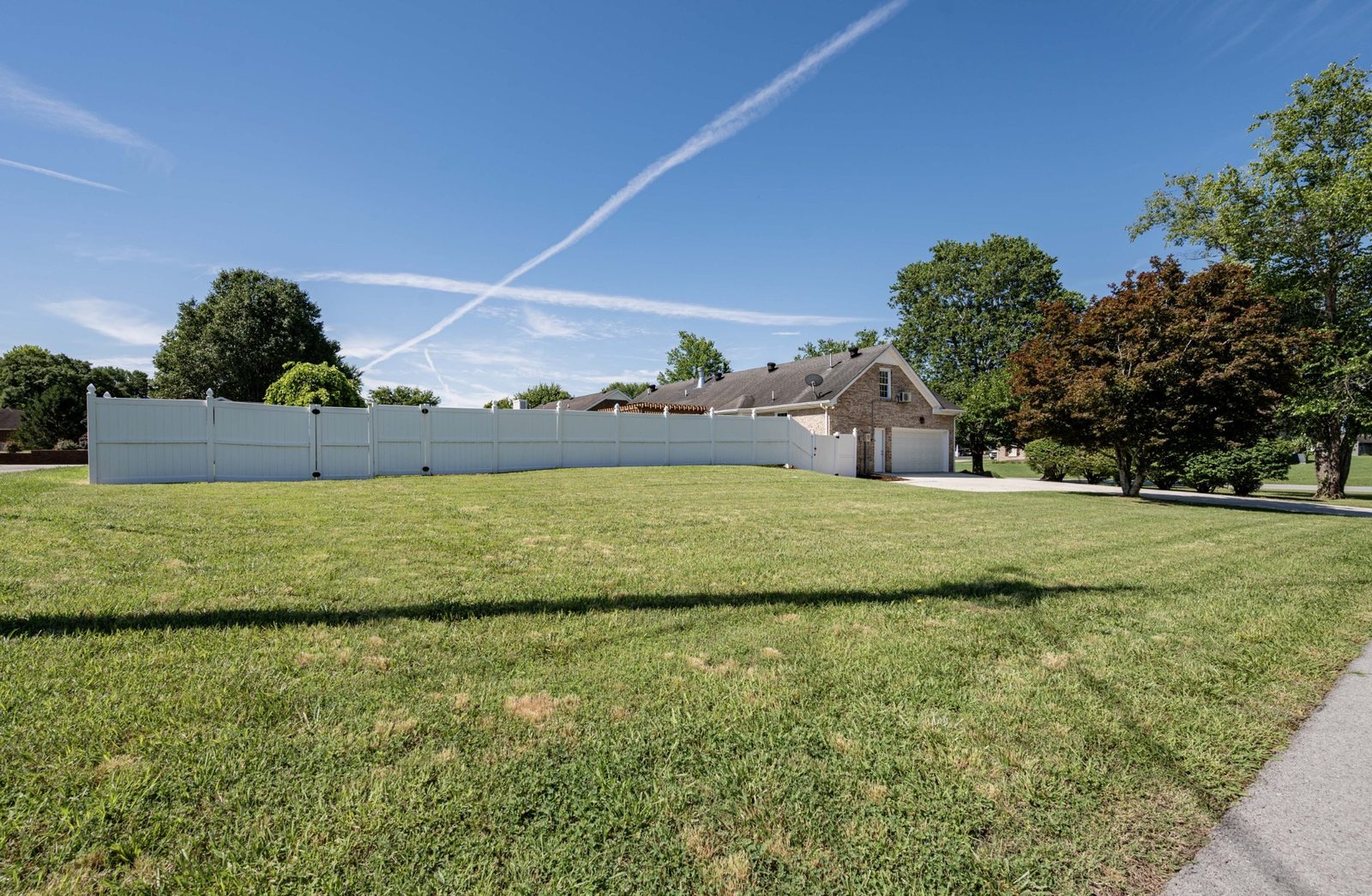 Back yard with vinyl privacy fence at 152 Greenbriar Circle