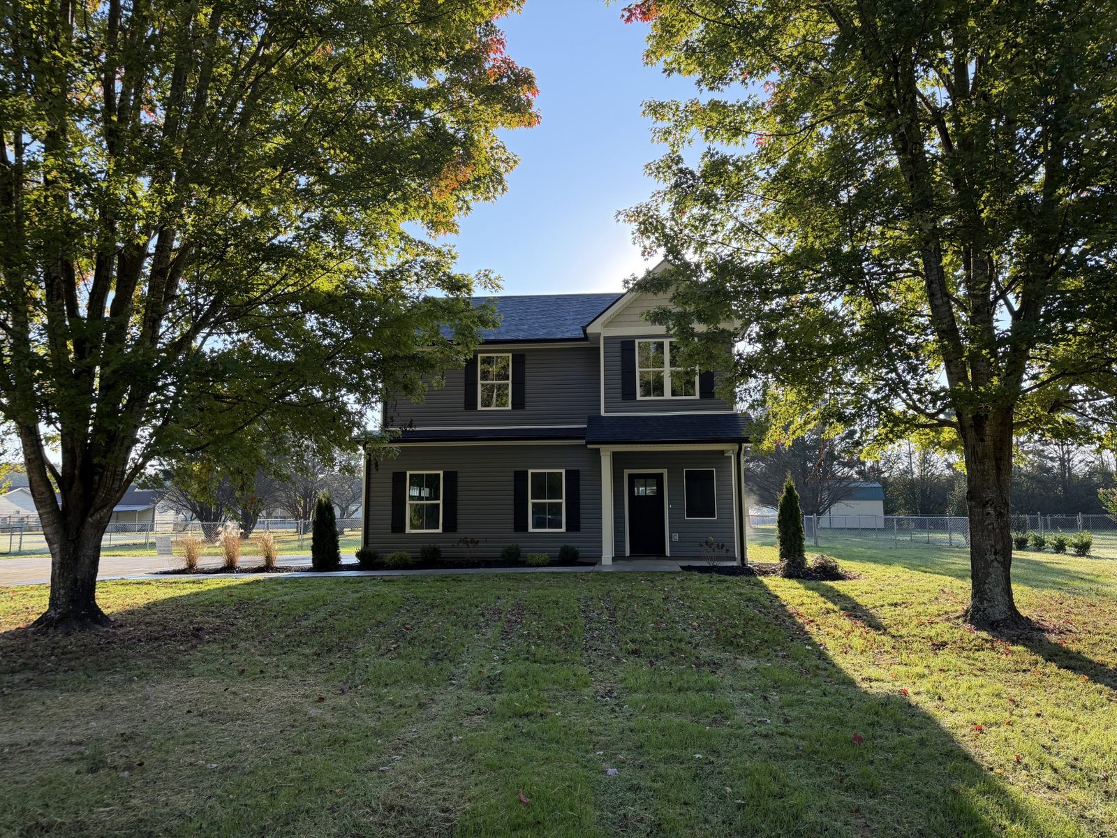 Front of the new two story home with shade trees at 1632 Parker Road