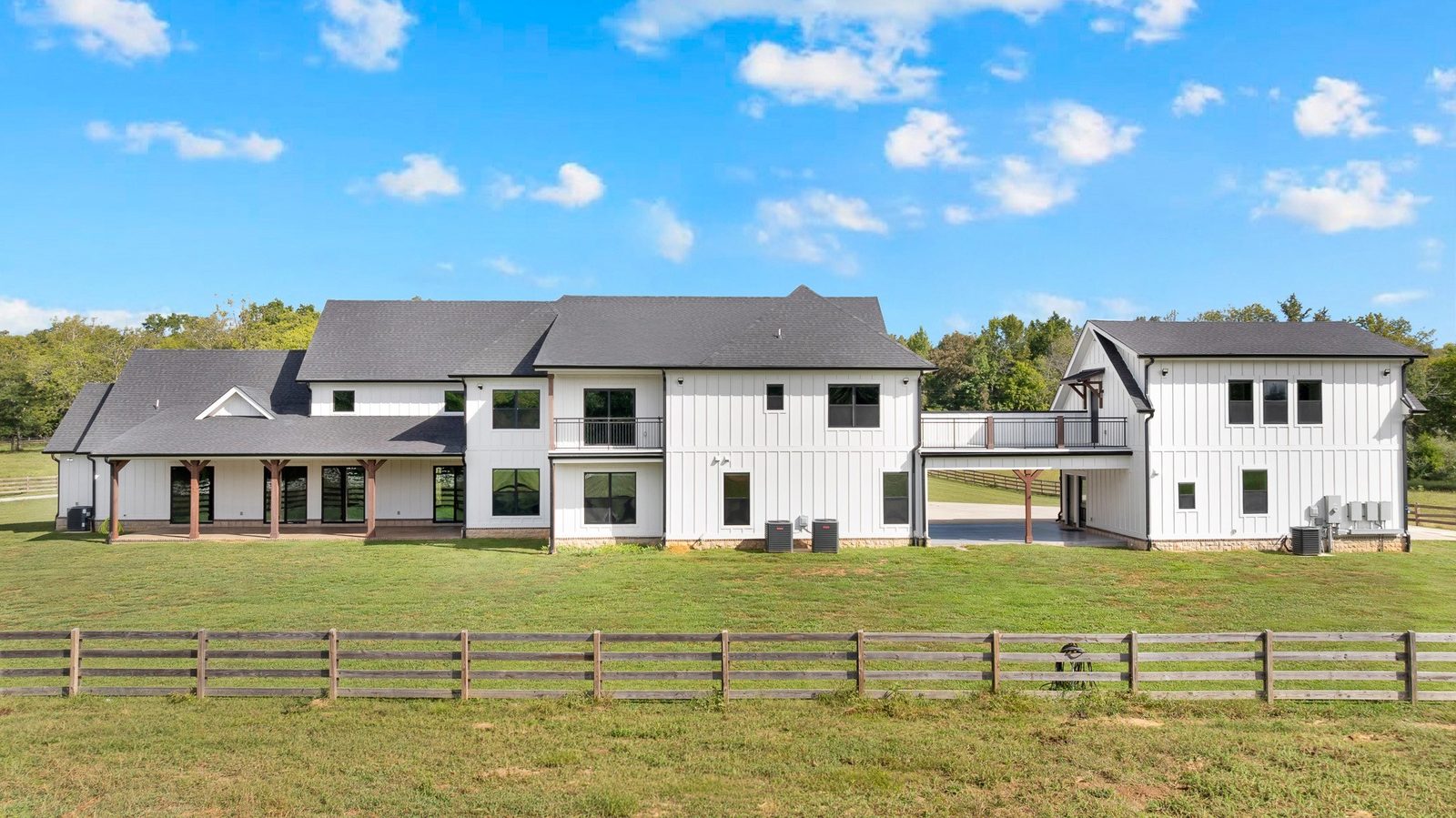 Rear of the home with fenced pasture at 2216 Sp Anderson Road