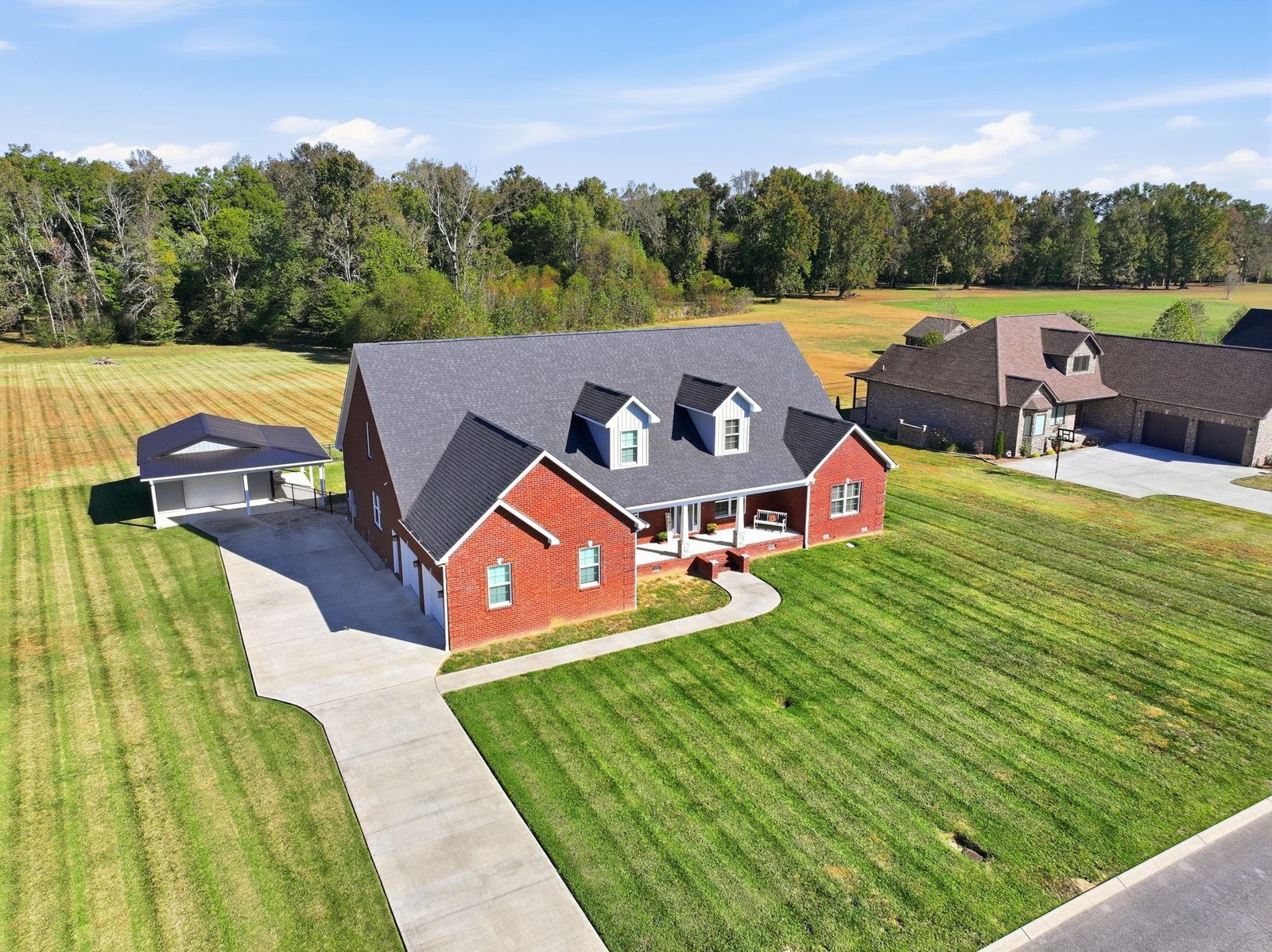 Aerial view of the home, driveway and lawn at 241 Roberts Creek Circle