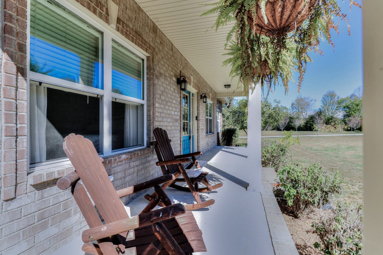 Covered front porch with rocking chairs at 247 Days End Lane