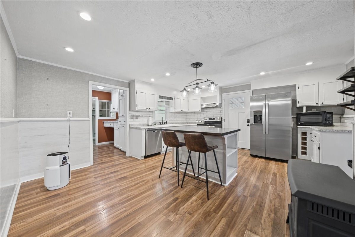 Kitchen with island and stainless appliances at 3057 Mt View Road
