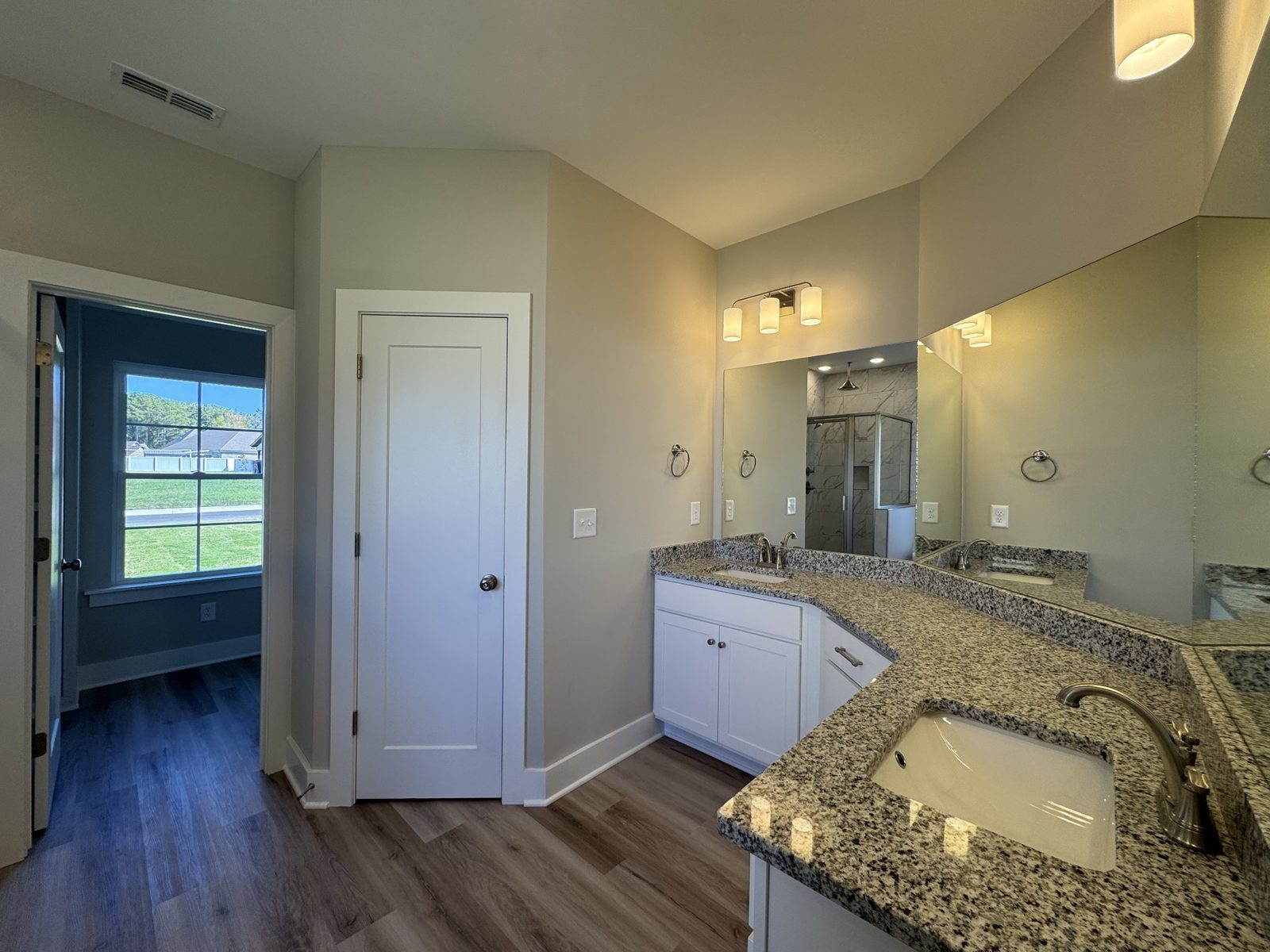 Primary bathroom vanity at 61 Spring House Drive