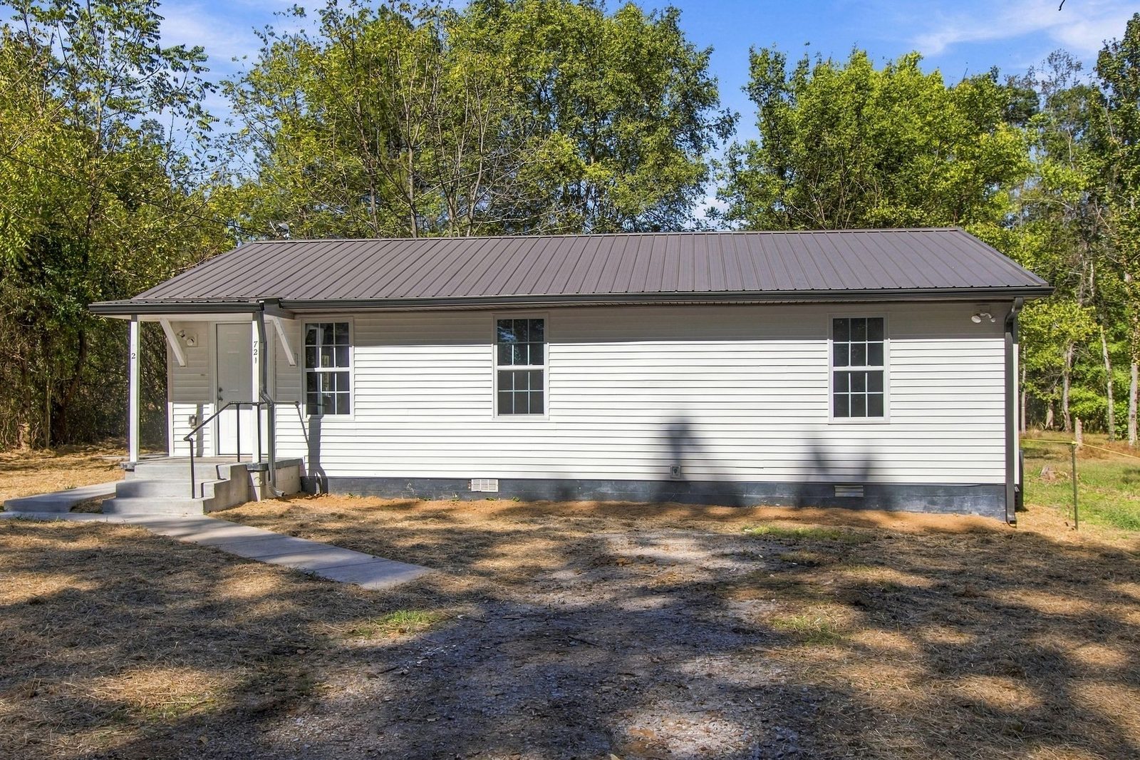 Front of the renovated single story home with a covered entry at 721 Taylor Road