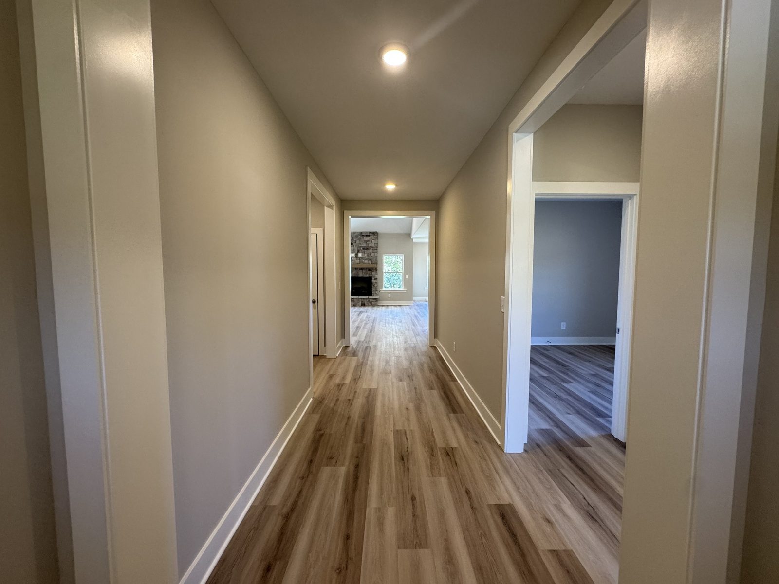 Hallway with wood look flooring at 79 Spring House Drive