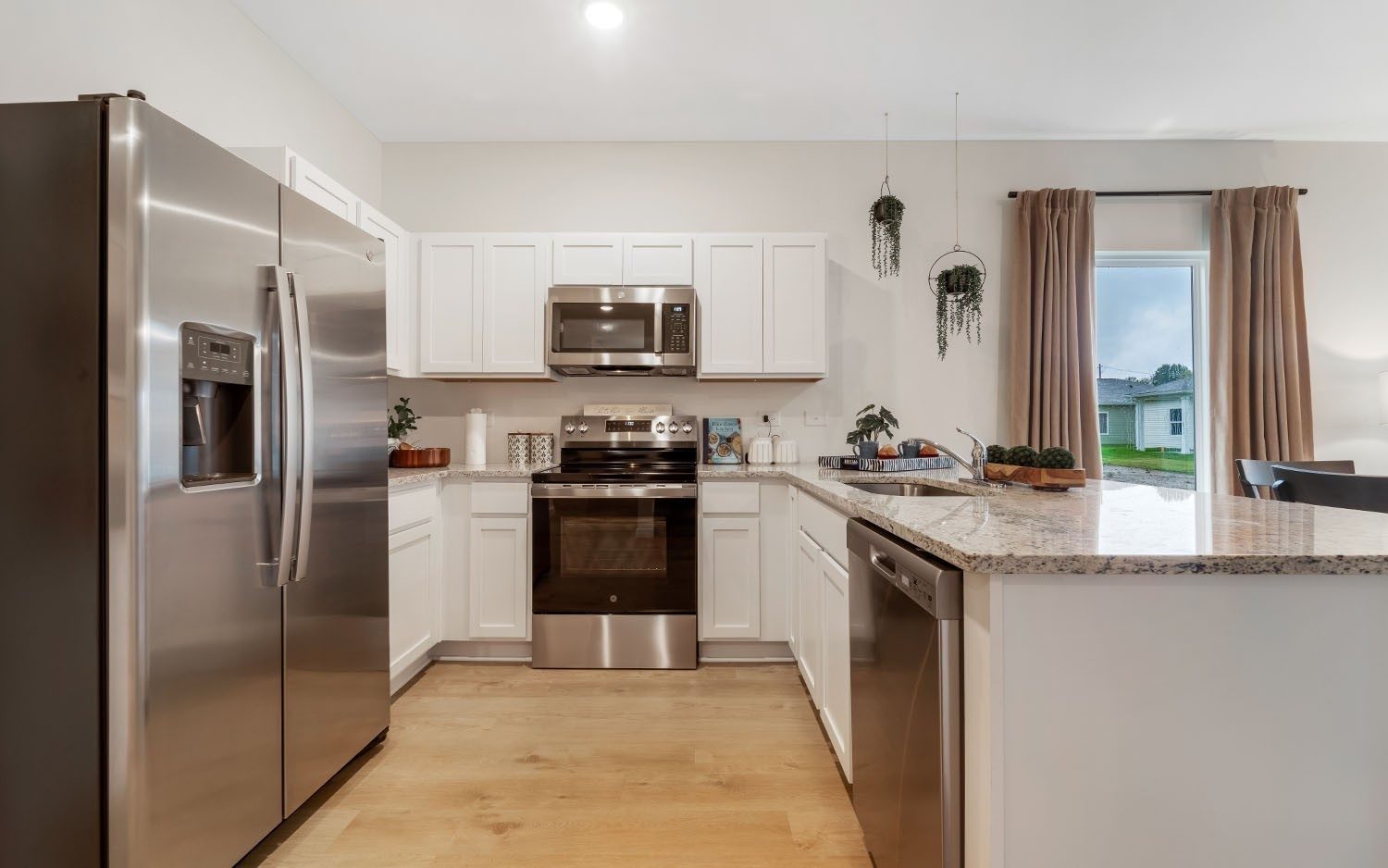 Kitchen with stainless appliances, shown for the same floor plan at 86 Stonehenge Lane