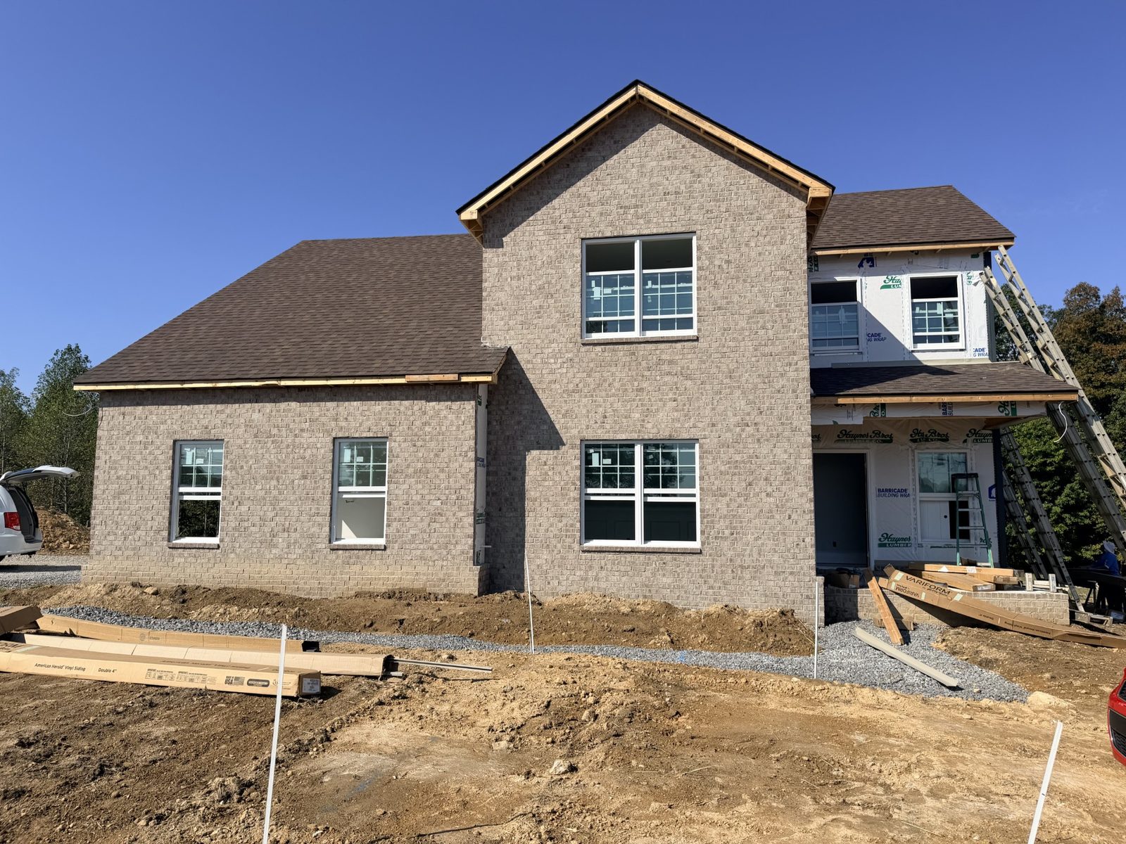 Side view of the home under construction at 8689 Fredonia Road
